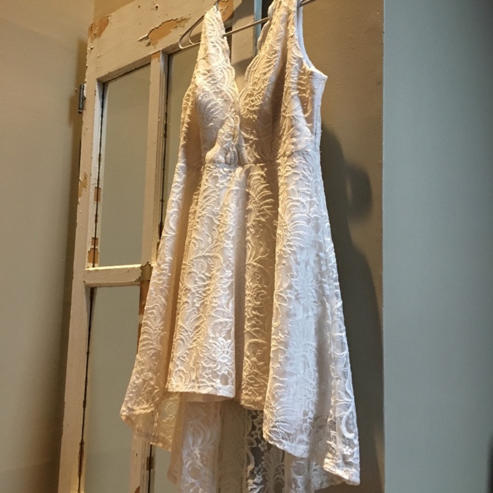 Party dress off white in color (ivory) sleeveless